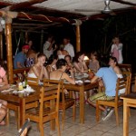 people enjoying dinner at beach dog cafe